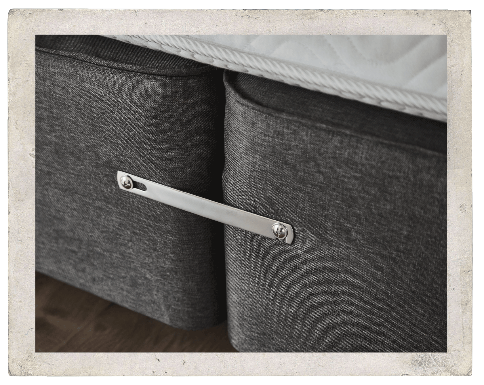 A close up of a divan with a linking bar